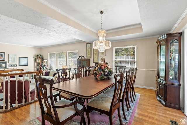 1376 Granada Dr, Bountiful, UT 84010 - dining room with plenty of natural light, light wood finished floors, a chandelier, a textured ceiling, and ornamental molding