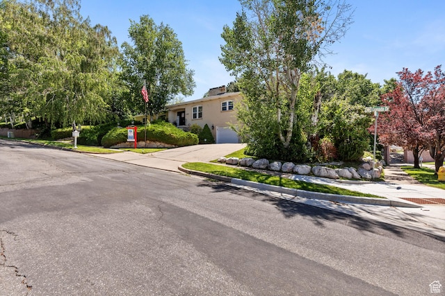 1376 Granada Dr, Bountiful, UT 84010 - view of front facade with concrete driveway and a garage