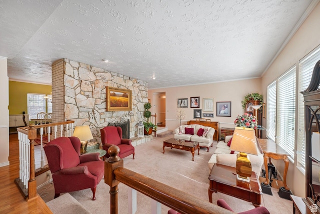1376 Granada Dr, Bountiful, UT 84010 - living room featuring a textured ceiling, a fireplace, wood finished floors, and crown molding