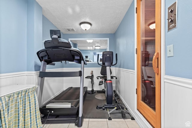 1376 Granada Dr, Bountiful, UT 84010 - exercise area featuring a wainscoted wall and a textured ceiling