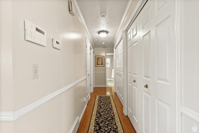 1376 Granada Dr, Bountiful, UT 84010 - hallway with crown molding, wood finished floors, and a textured ceiling