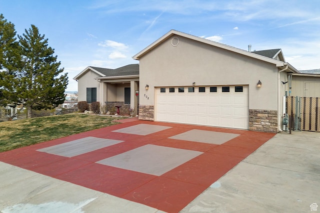 208 N Guidelight Dr, Cedar City, UT 84720 - single story home with stone siding, a garage, stucco siding, a front lawn, and driveway