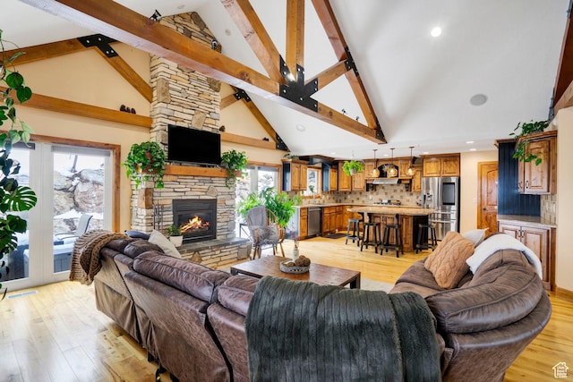 1603 E Millbrook Way, Bountiful, UT 84010 - living area with light wood-style floors, a fireplace, high vaulted ceiling, healthy amount of natural light, and beam ceiling