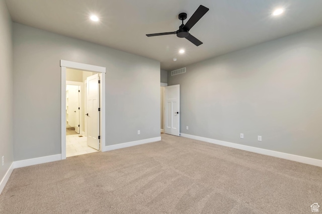 3240 W Oxford Loop Unit 219, Mountain Green, UT 84050 - unfurnished bedroom with recessed lighting, baseboards, light colored carpet, and visible vents