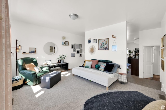 living room featuring carpet and visible vents