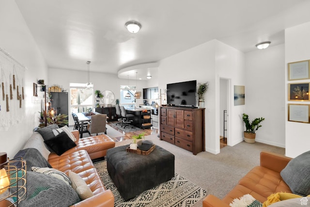 living room featuring light carpet