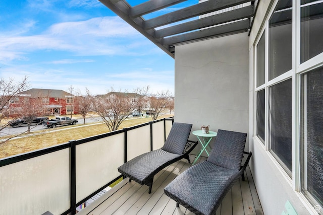 balcony with a residential view and a pergola