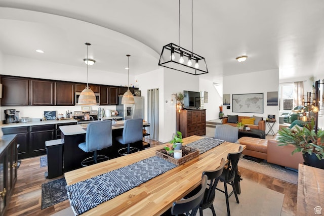 dining area with wood finished floors