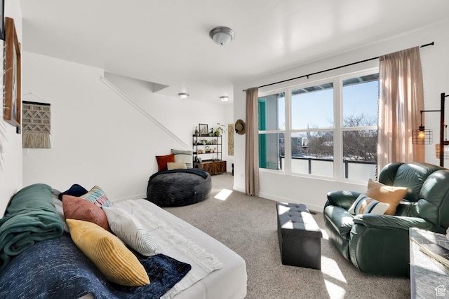 carpeted bedroom featuring baseboards
