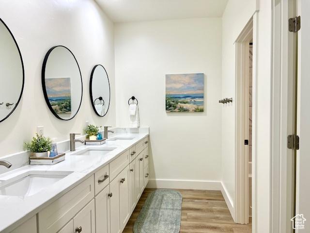 650 Blue Sage Dr, Fish Haven, ID 83287 - full bath featuring baseboards, wood finished floors, and a sink