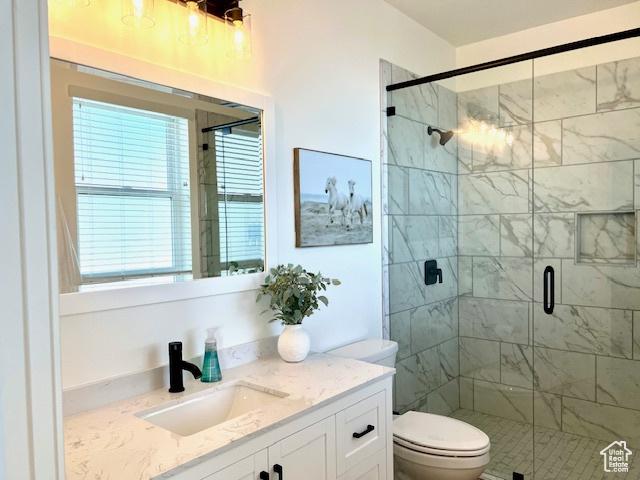 650 Blue Sage Dr, Fish Haven, ID 83287 - bathroom with toilet, vanity, and a stall shower