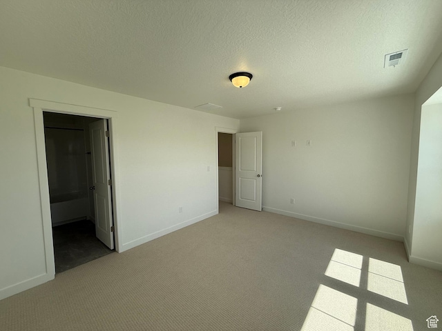 unfurnished bedroom featuring visible vents, baseboards, and light carpet