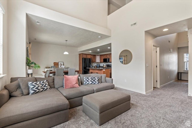 576 E 1540 S, Lehi, UT 84043 - living area with light carpet, baseboards, visible vents, and recessed lighting