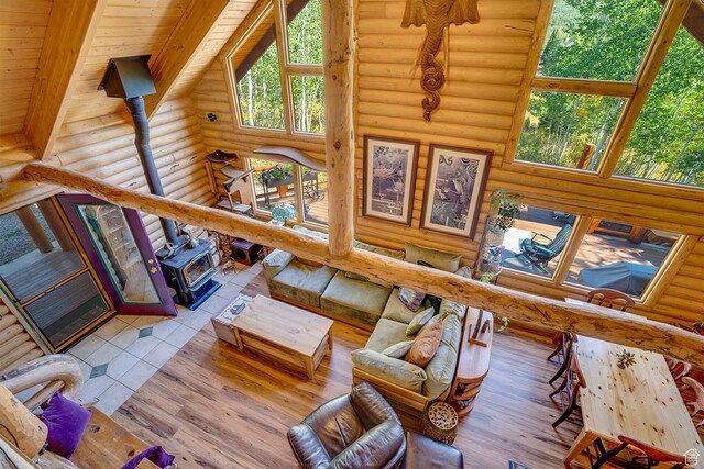 4547 Fawn Way Unit 2050, Heber City, UT 84032 - living room with high vaulted ceiling, wood ceiling, beam ceiling, wood finished floors, and a wood stove