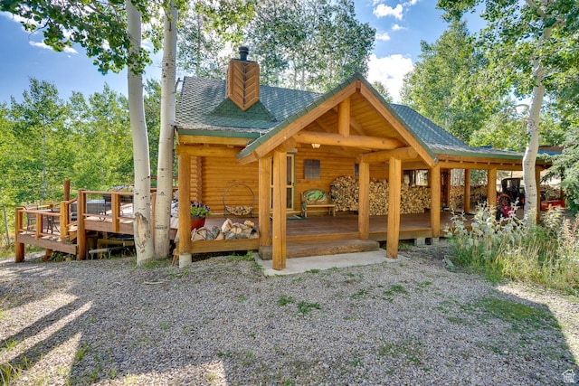 4547 Fawn Way Unit 2050, Heber City, UT 84032 - exterior space featuring a shingled roof, a chimney, and log exterior