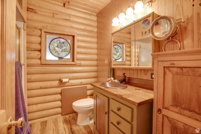 4547 Fawn Way Unit 2050, Heber City, UT 84032 - bathroom with log walls, toilet, wood finished floors, and vanity