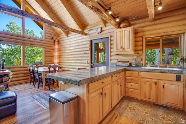 4547 Fawn Way Unit 2050, Heber City, UT 84032 - kitchen with tile counters, light wood finished floors, beam ceiling, a sink, and wood ceiling