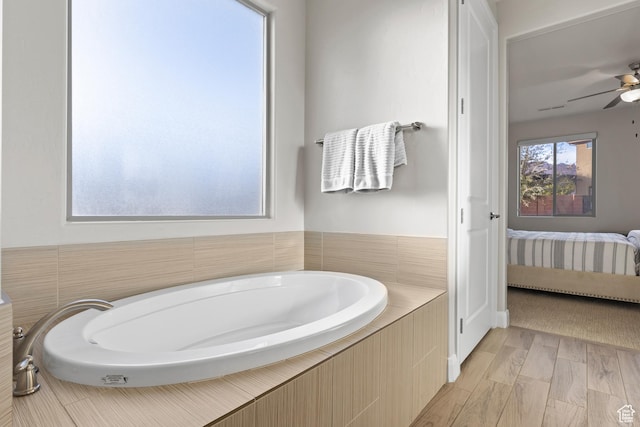 3837 W Lazy River Cir Unit 111, Santa Clara, UT 84765 - bathroom with a ceiling fan, wood finished floors, ensuite bathroom, and a bath