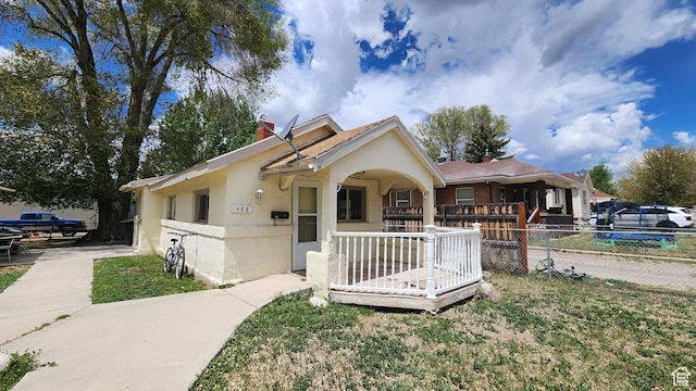 488 S 100 W, Price, UT 84501 - bungalow featuring stucco siding, fence, and a chimney