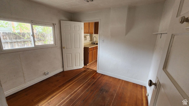 488 S 100 W, Price, UT 84501 - unfurnished bedroom featuring dark wood-style floors, a sink, and baseboards