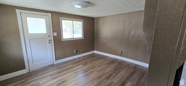 488 S 100 W, Price, UT 84501 - entrance foyer with wood finished floors, baseboards, and a textured ceiling