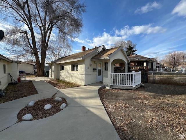 488 S 100 W, Price, UT 84501 - view of front facade featuring fence, stucco siding, and a chimney