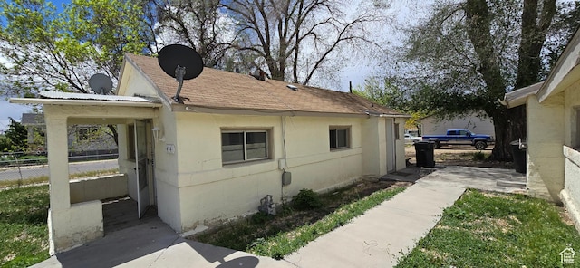 488 S 100 W, Price, UT 84501 - view of home's exterior with fence, stucco siding, and a shingled roof