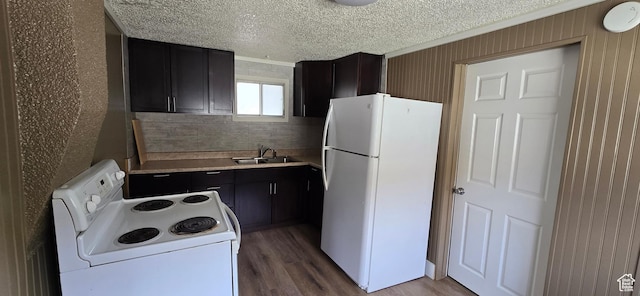 488 S 100 W, Price, UT 84501 - kitchen featuring white appliances, a sink, wood finished floors, light countertops, and dark cabinets