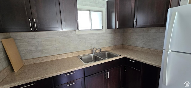 488 S 100 W, Price, UT 84501 - kitchen featuring freestanding refrigerator, a sink, backsplash, light countertops, and dark brown cabinetry