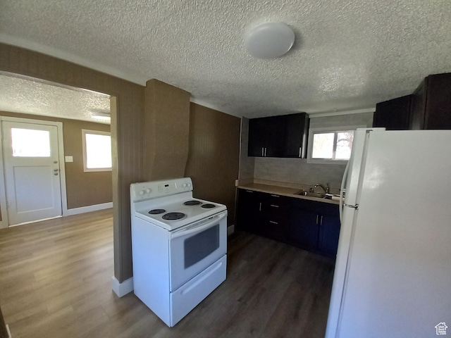 488 S 100 W, Price, UT 84501 - kitchen featuring white appliances, a sink, a textured ceiling, wood finished floors, and dark cabinets