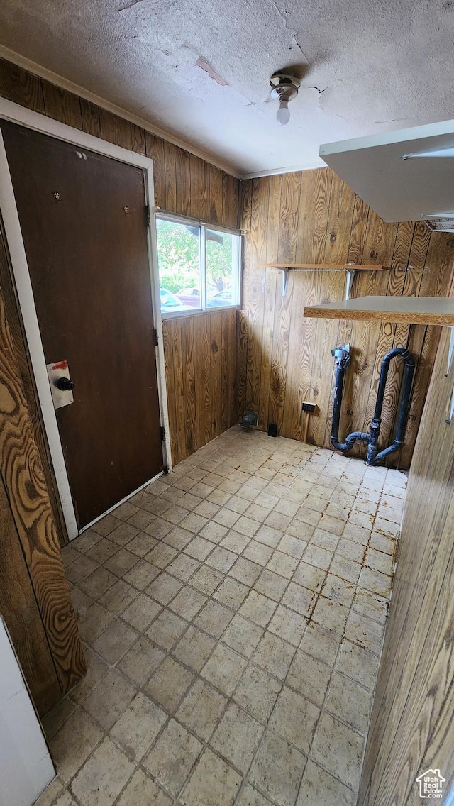488 S 100 W, Price, UT 84501 - foyer entrance with wood walls, a textured ceiling, and a ceiling fan