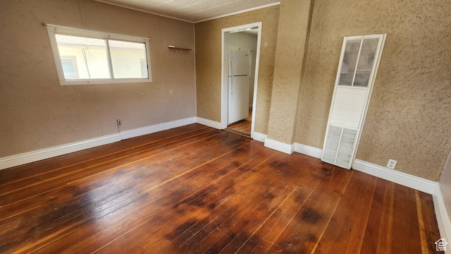 488 S 100 W, Price, UT 84501 - unfurnished bedroom featuring a heating unit, hardwood / wood-style floors, and ornamental molding