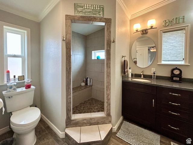 full bathroom featuring toilet, ornamental molding, baseboards, and a walk in shower