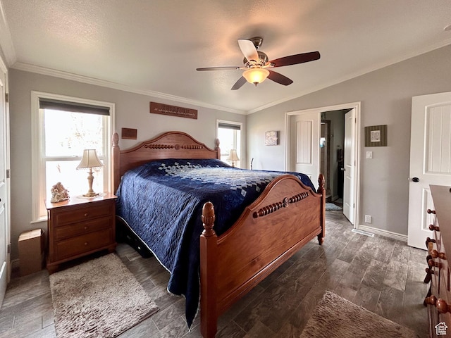 bedroom with multiple windows, lofted ceiling, wood finished floors, and ornamental molding