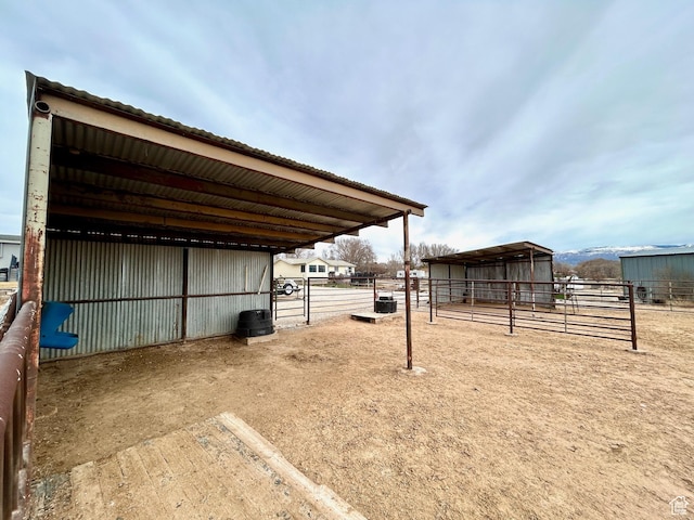 view of yard featuring an outdoor structure and an exterior structure