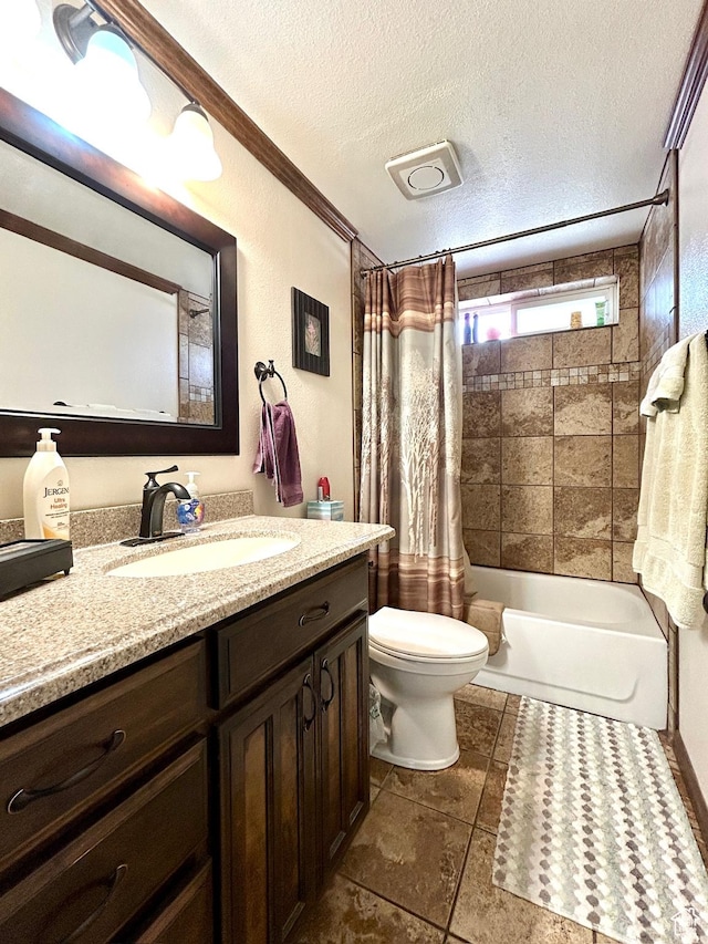 full bathroom featuring shower / bath combo, a textured ceiling, toilet, and vanity