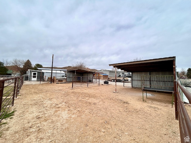 view of yard with an outdoor structure and an exterior structure