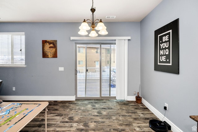 687 N 130 E, Smithfield, UT 84335 - doorway with dark wood finished floors, baseboards, visible vents, and an inviting chandelier