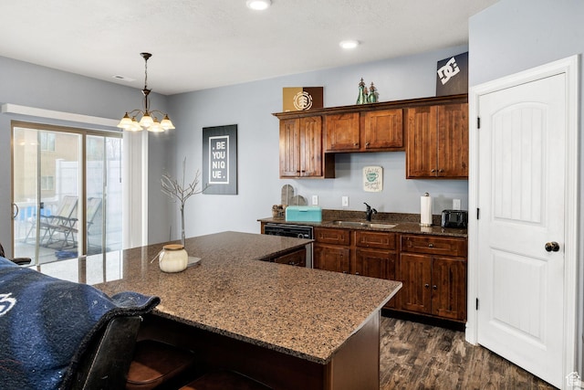 687 N 130 E, Smithfield, UT 84335 - kitchen featuring hanging light fixtures, dark wood-style floors, dark stone countertops, and a sink