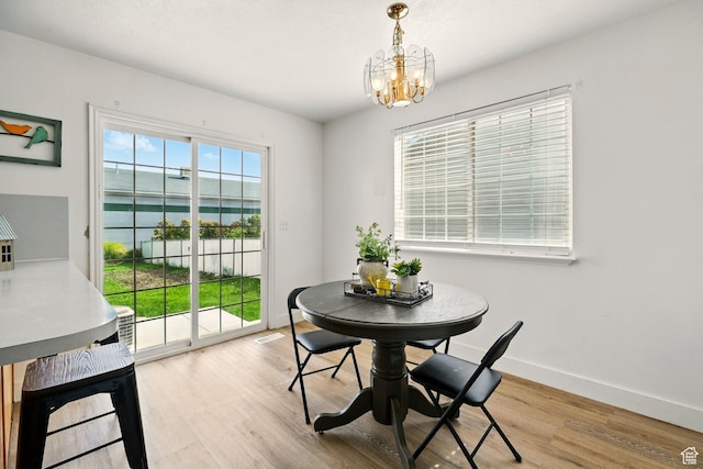 495 W 1330 N, Logan, UT 84341 - dining space with a chandelier, wood finished floors, and a water view