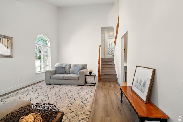 495 W 1330 N, Logan, UT 84341 - living room featuring wood finished floors, a towering ceiling, and stairs