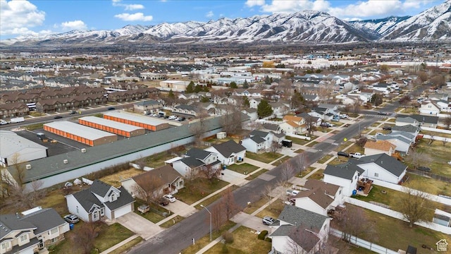 495 W 1330 N, Logan, UT 84341 - aerial view of property's location with nearby suburban area and a mountain backdrop