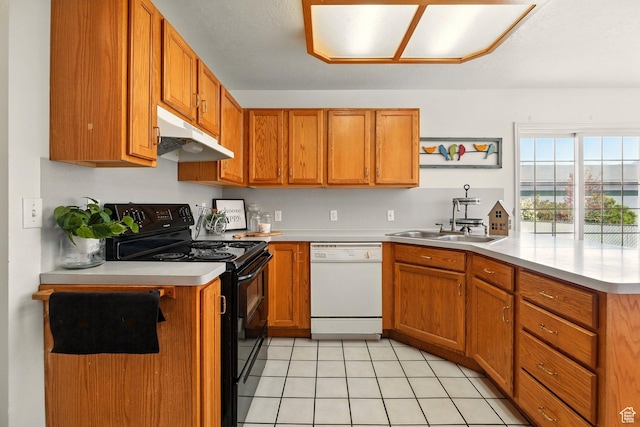 495 W 1330 N, Logan, UT 84341 - kitchen with white dishwasher, black range with electric stovetop, under cabinet range hood, a peninsula, and light countertops