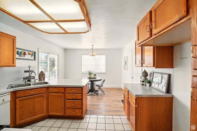 495 W 1330 N, Logan, UT 84341 - kitchen with a peninsula, brown cabinets, plenty of natural light, and light countertops