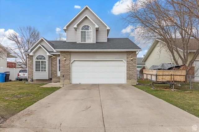 495 W 1330 N, Logan, UT 84341 - traditional home featuring brick siding, a garage, driveway, and a shingled roof