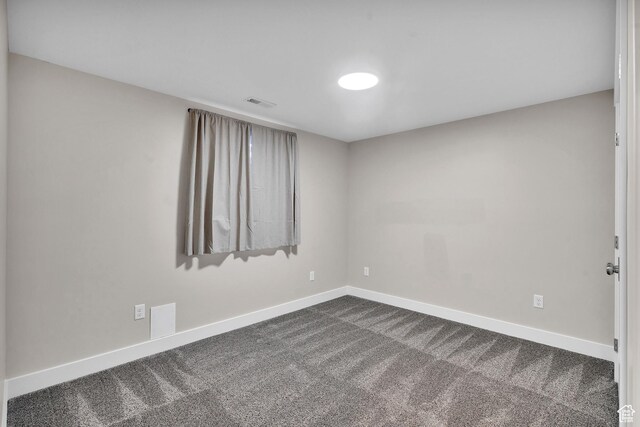 681 S Vance Dr W, Layton, UT 84041 - unfurnished room featuring baseboards and dark carpet