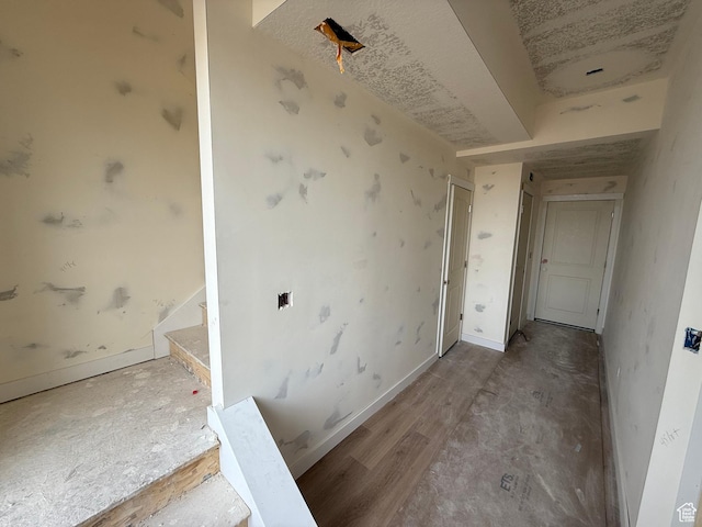 interior space featuring baseboards and stairs