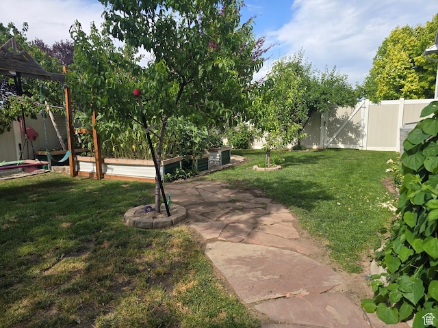 8894 S Sun Leaf Dr, West Jordan, UT 84088 - fenced backyard with a garden