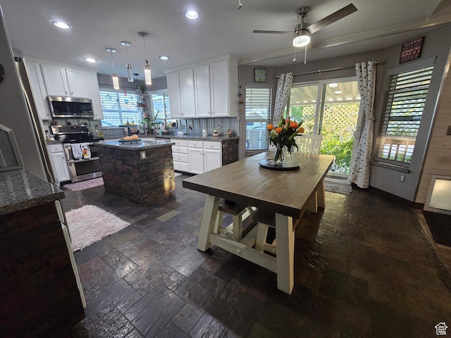 8894 S Sun Leaf Dr, West Jordan, UT 84088 - kitchen featuring appliances with stainless steel finishes, backsplash, a kitchen island, recessed lighting, and a ceiling fan