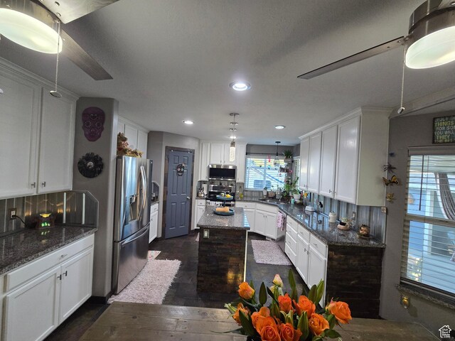 8894 S Sun Leaf Dr, West Jordan, UT 84088 - kitchen with appliances with stainless steel finishes, white cabinets, recessed lighting, and dark wood-style floors